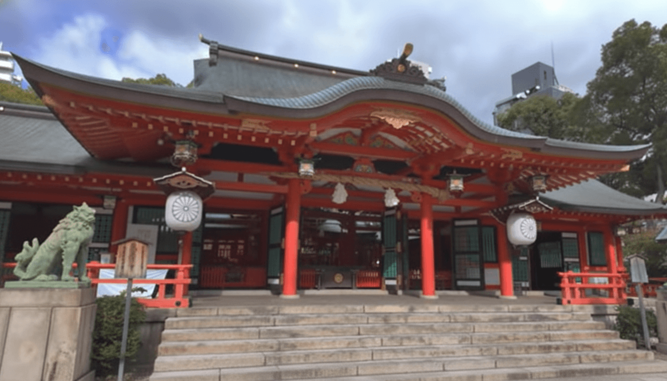Vermillion torii gate and main hall of Ikuta Shrine in central Kobe Japan