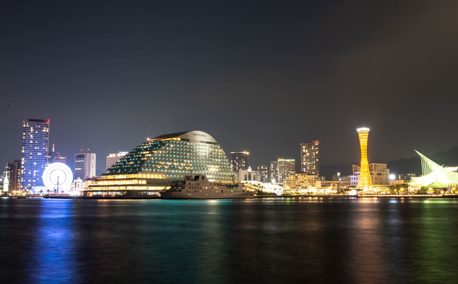 BE KOBE sign and Kobe Port Tower at Meriken Park waterfront in Kobe Japan