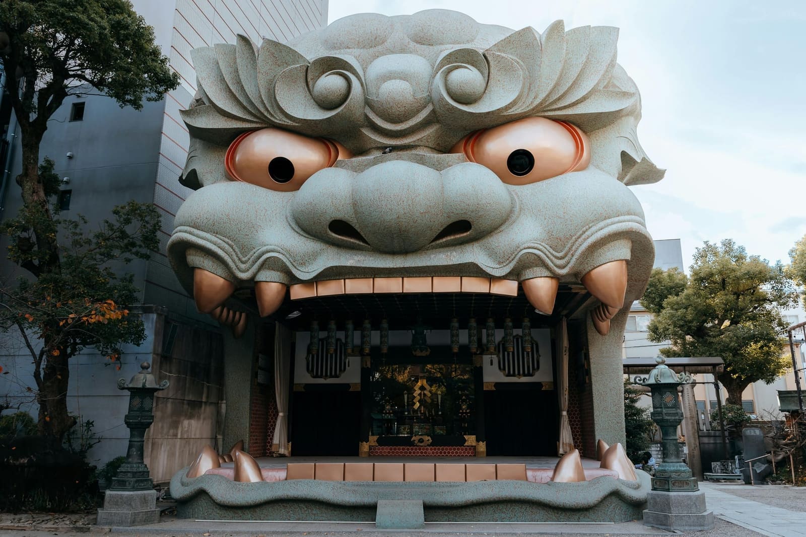Namba Yasaka Shrine giant lion head stage with open mouth forming the main stage, one of Osaka's most visually striking shrines, Japan