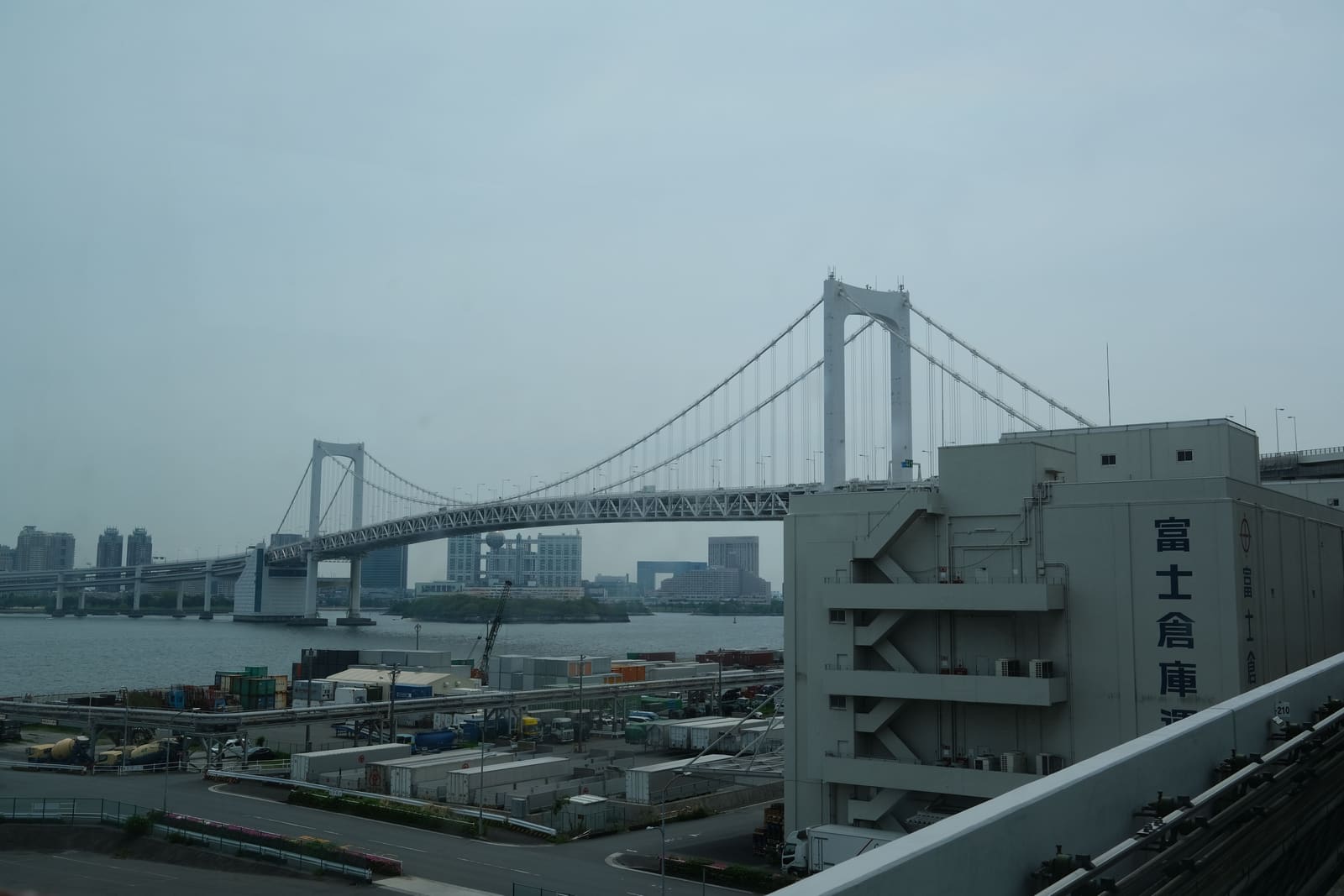 Rainbow Bridge spanning Tokyo Bay with Odaiba waterfront in the background, Tokyo, Japan
