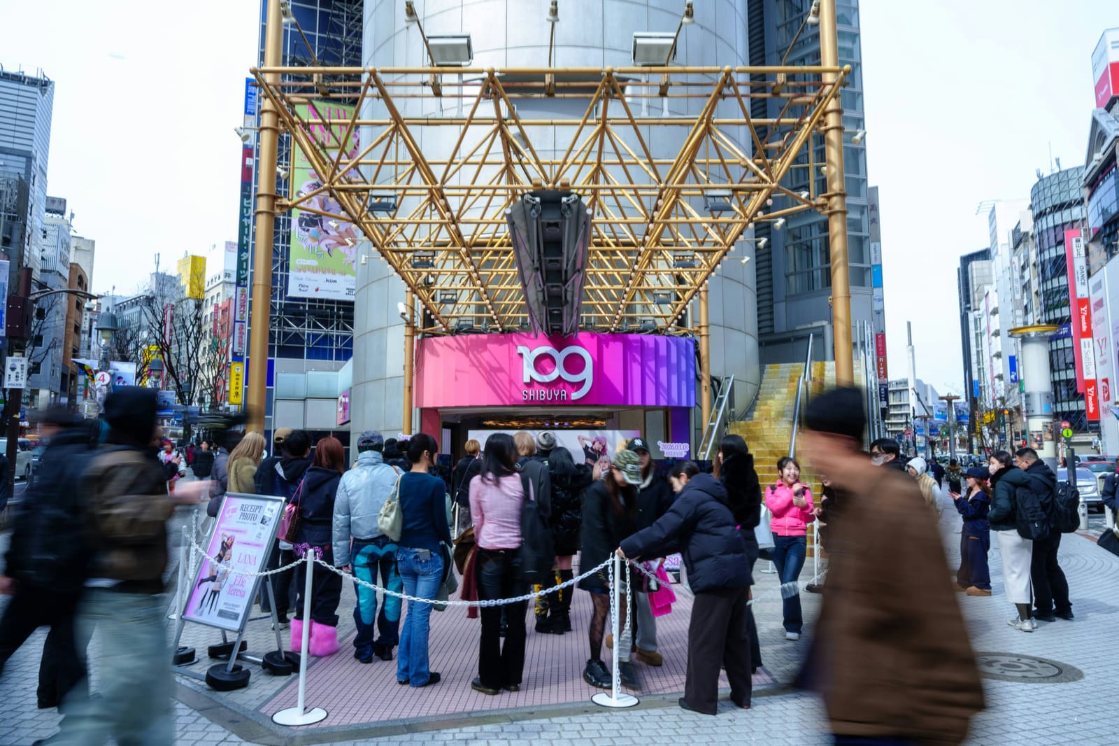 Shibuya district at night with neon signs glowing along the streets near Shibuya 109