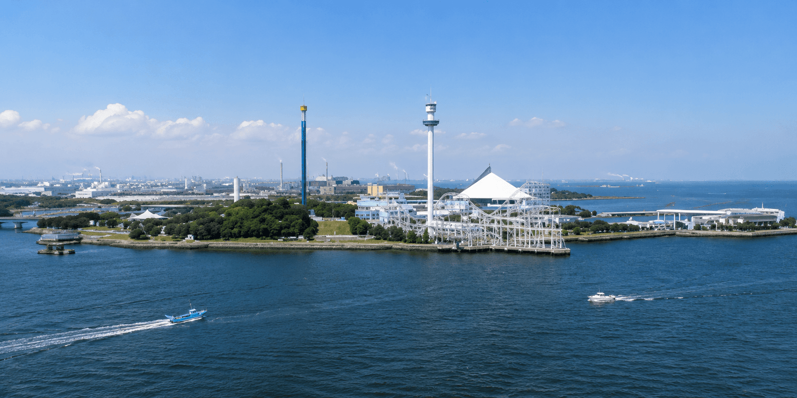 Yokohama Hakkeijima Sea Paradise island complex with the Aqua Museum aquarium building and Surf Coaster Leviathan track running out over the bay