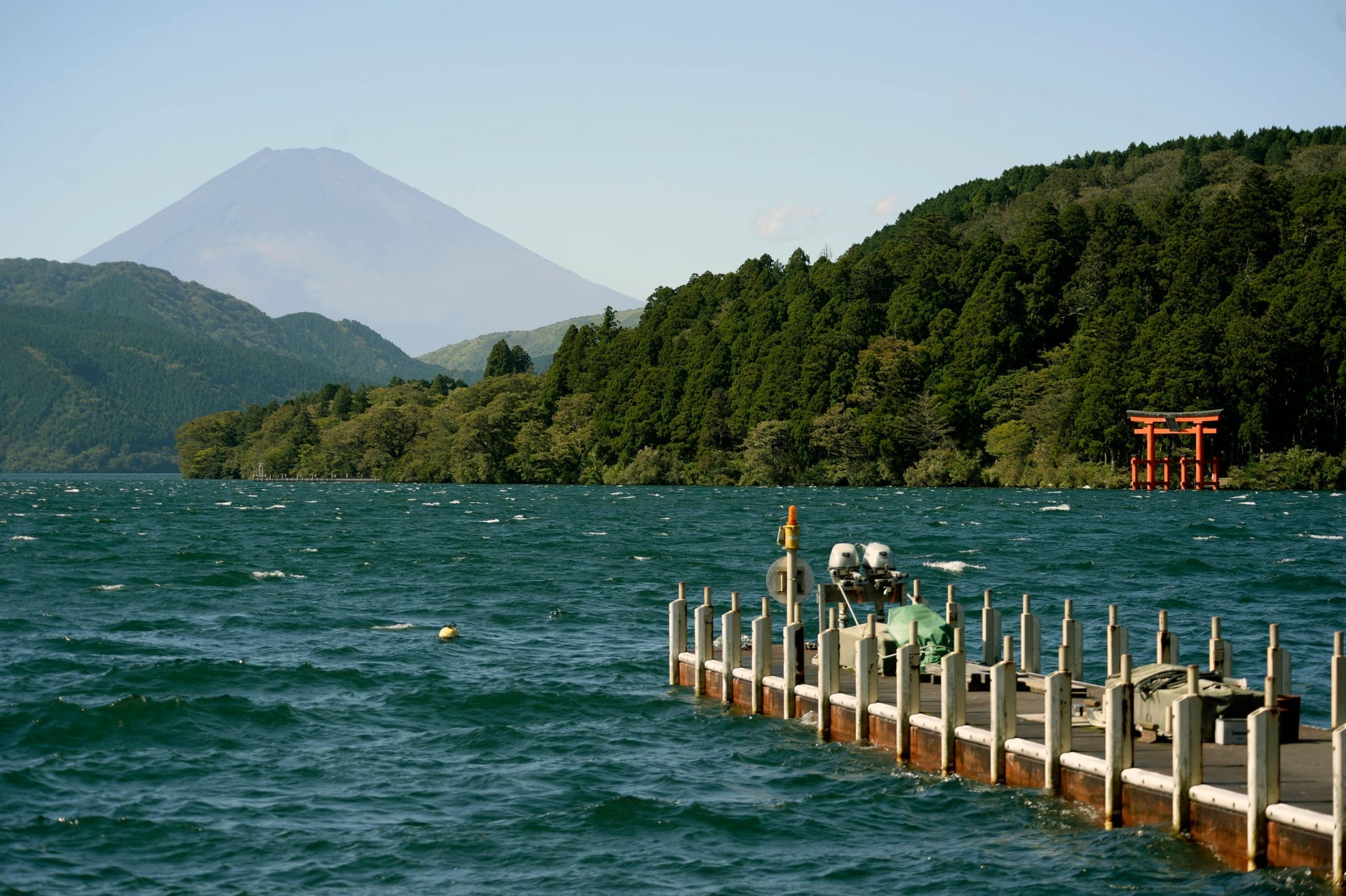 Lake Ashi shoreline forested hills and torii gate Hakone Japan