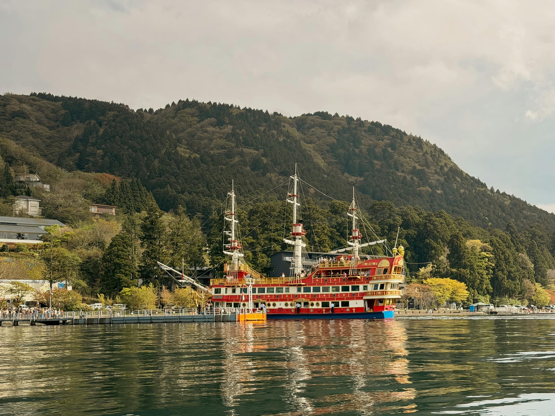 Sightseeing cruise ship sailing on Lake Ashi with Mt Fuji backdrop Hakone Japan