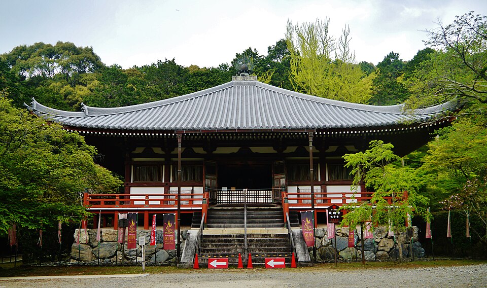 Ancient five-story pagoda at Daigo-ji Temple rising above the forested grounds, the oldest surviving wooden structure in Kyoto