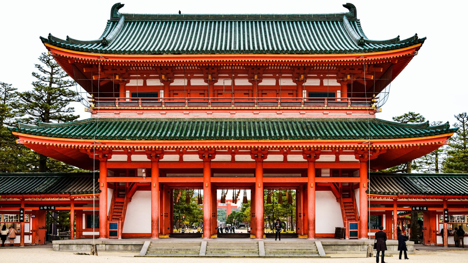 Grand vermilion shrine buildings and covered corridors of Heian Shrine's ceremonial courtyard