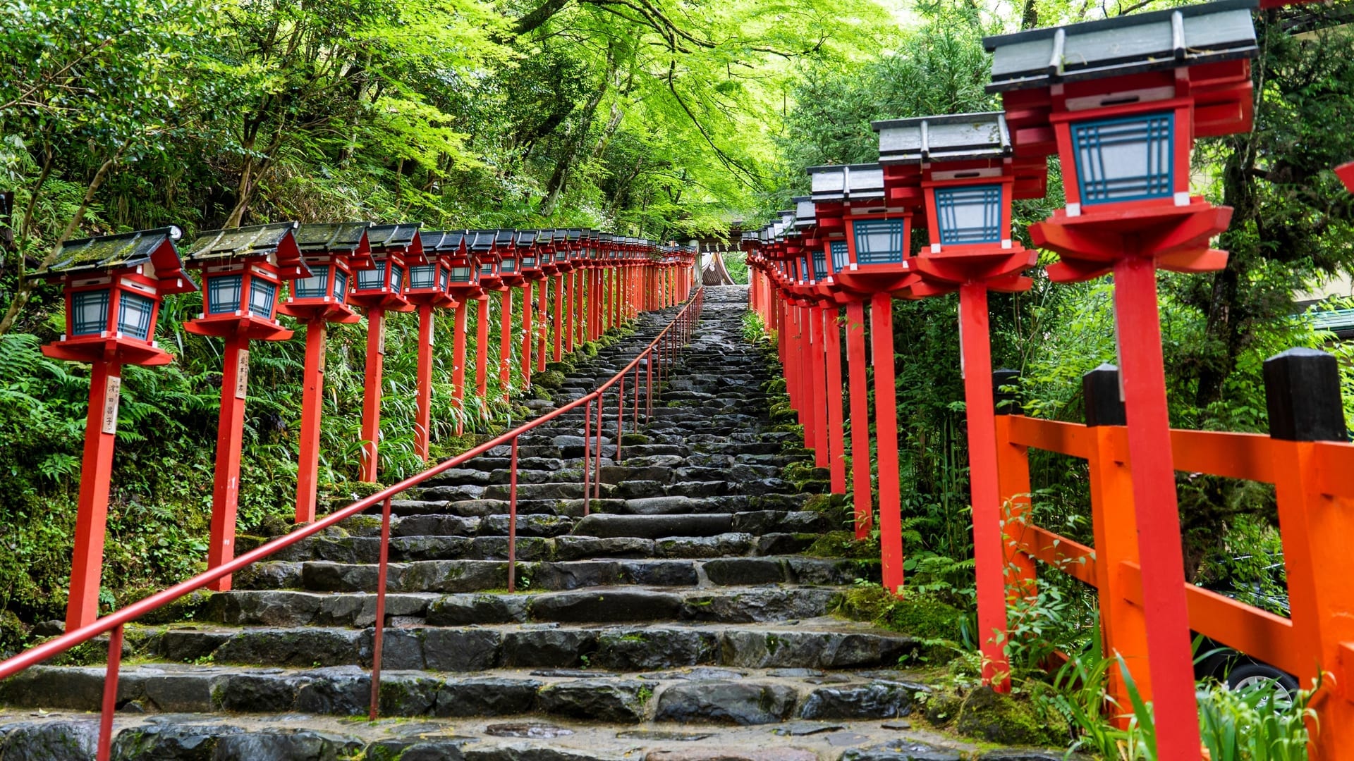 Kifune Shrine stone lantern-lined pathway leading through the forested valley to the main shrine building, Kyoto