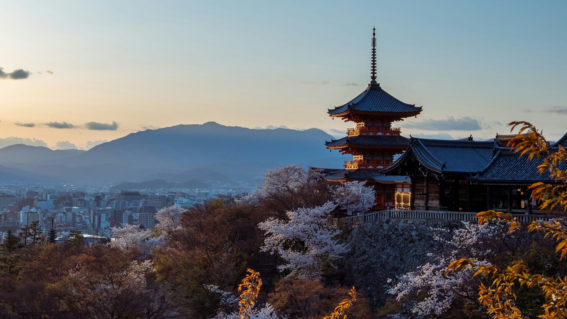 Kiyomizu-dera Temple wooden stage jutting out over the forested hillside with views of Kyoto below