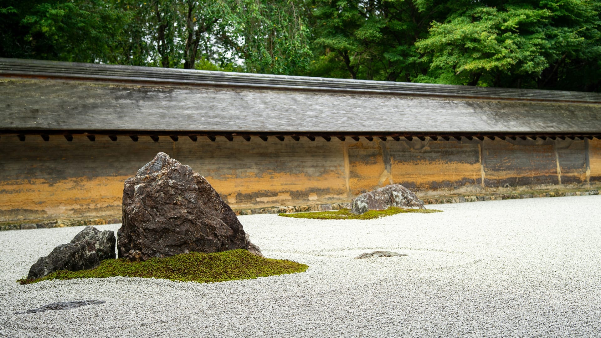 Heian-period pond garden with pine trees and reflections at Ryoan-ji Temple in Kyoto