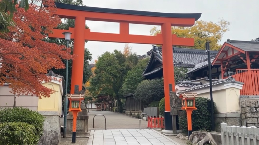Vermilion main gate of Yasaka Shrine illuminated by white paper lanterns at the entrance to Gion in Kyoto