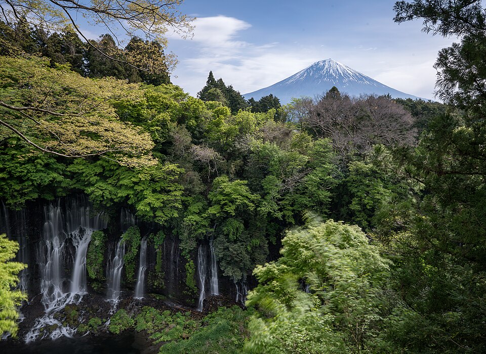Shiraito Falls wide curtain waterfall white streams over volcanic cliff face lush forest Fujinomiya Japan