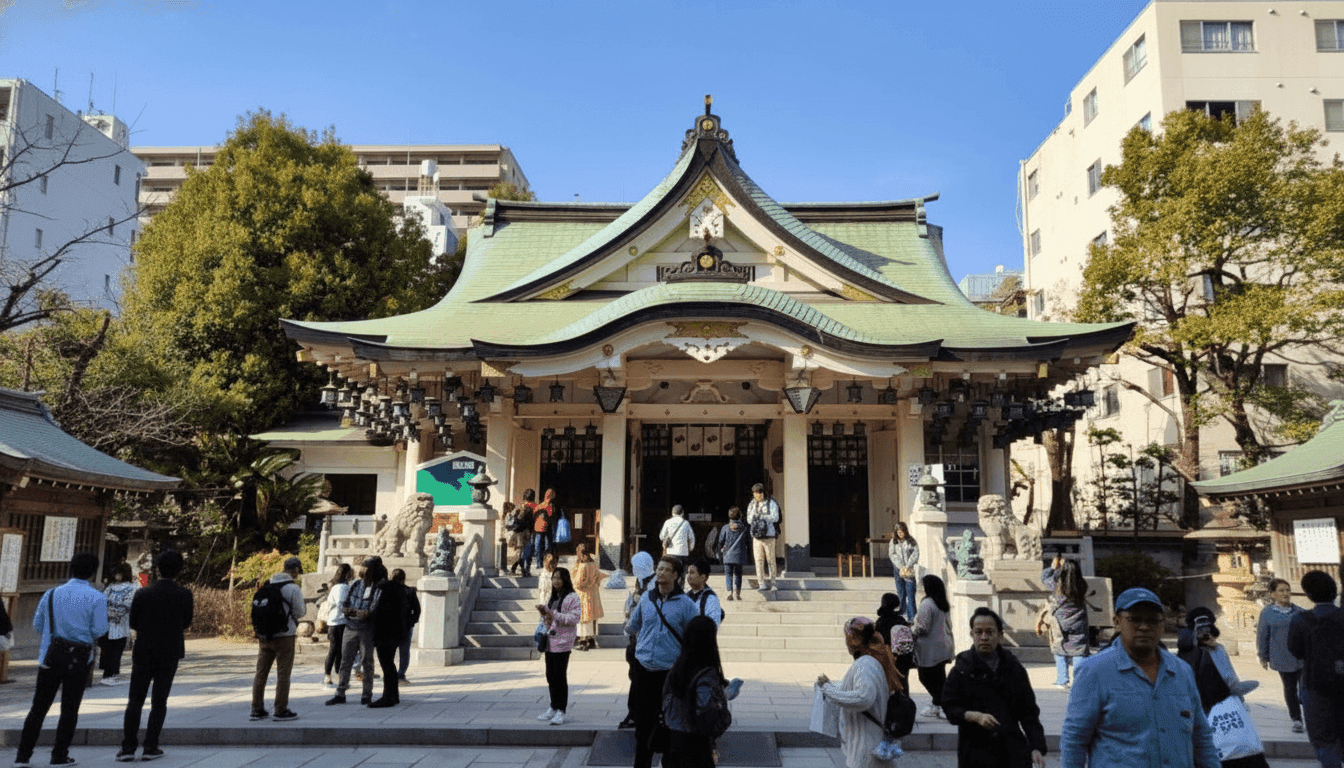 Namba Yasaka Shrine enormous lion head shishiden stage with wide open mouth and sharp eyes rising above the shrine grounds, Osaka Japan