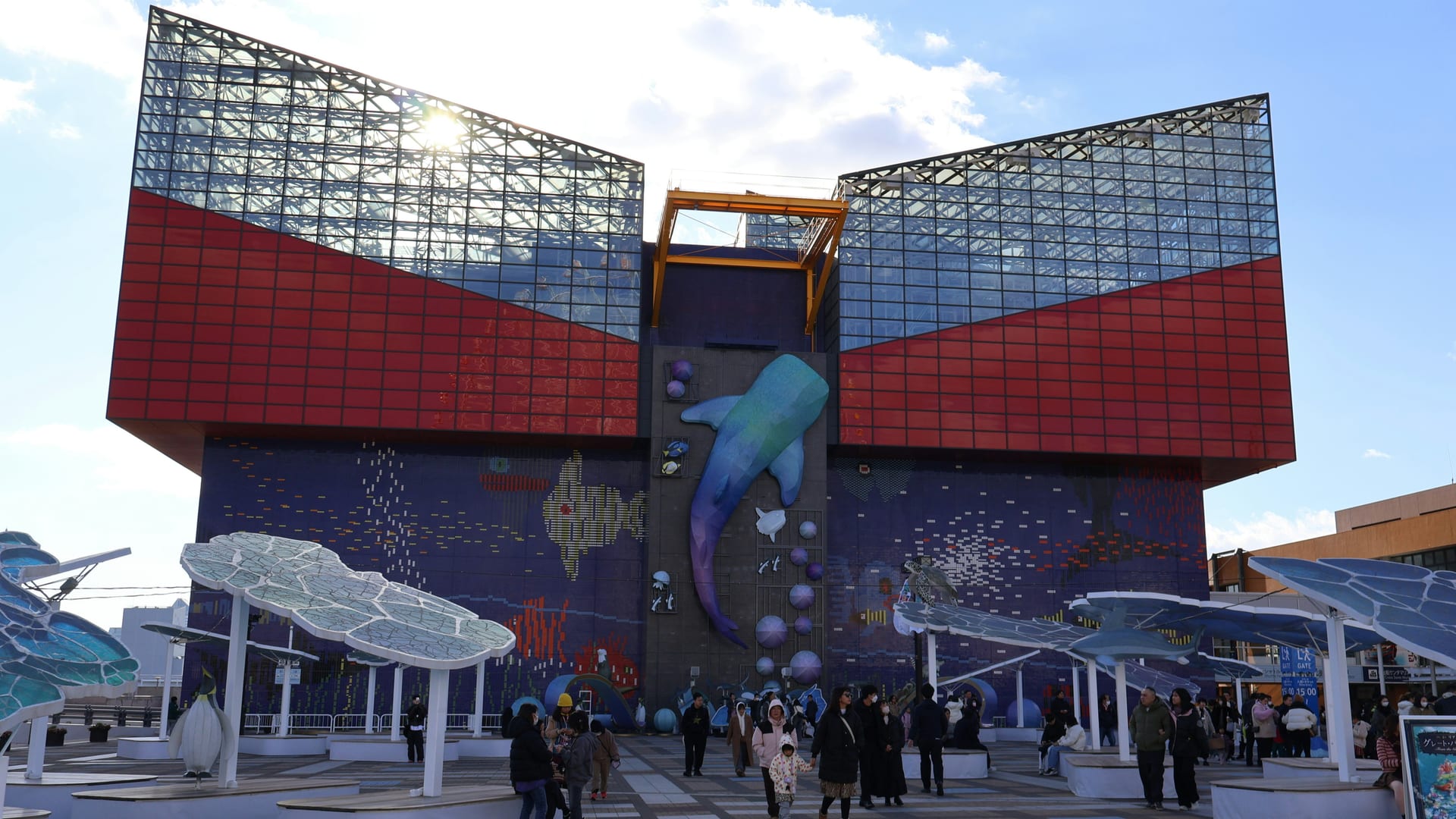 Osaka Aquarium Kaiyukan whale shark tank with Pacific Ocean exhibit and visitors watching marine life, Japan