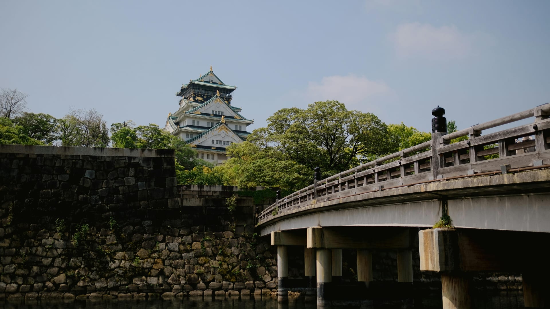 Osaka Castle Park wide walking paths and open lawns surrounding the castle moat, Osaka Japan
