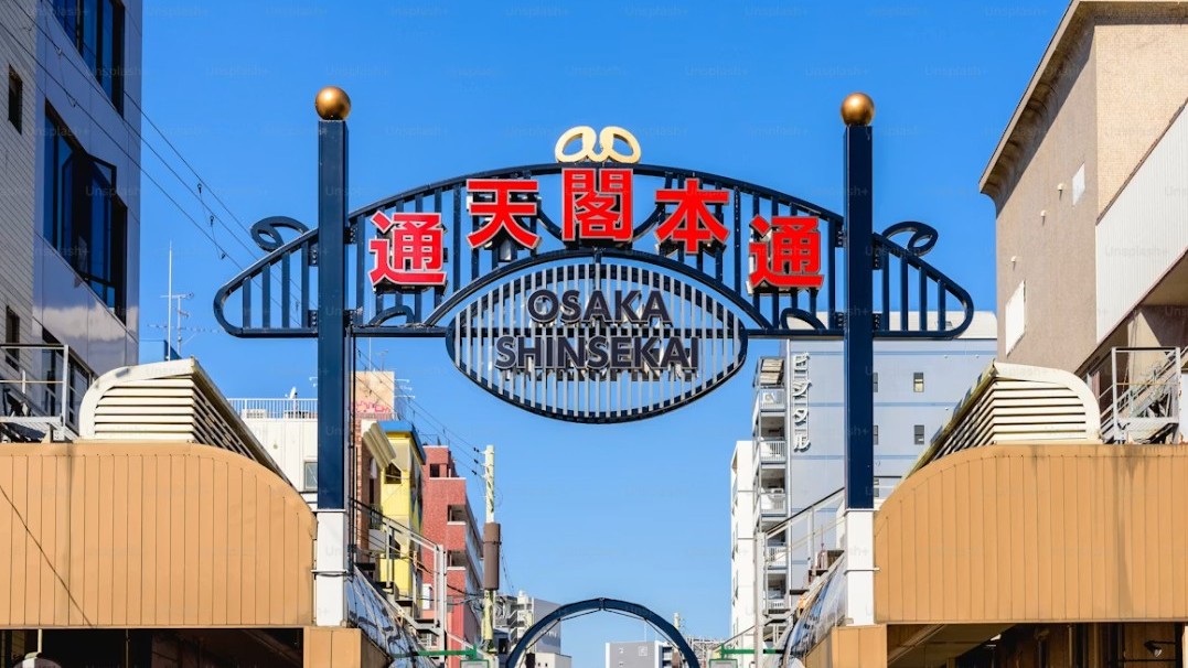 Shinsekai kushikatsu restaurants and retro entertainment street atmosphere at evening, Osaka Japan