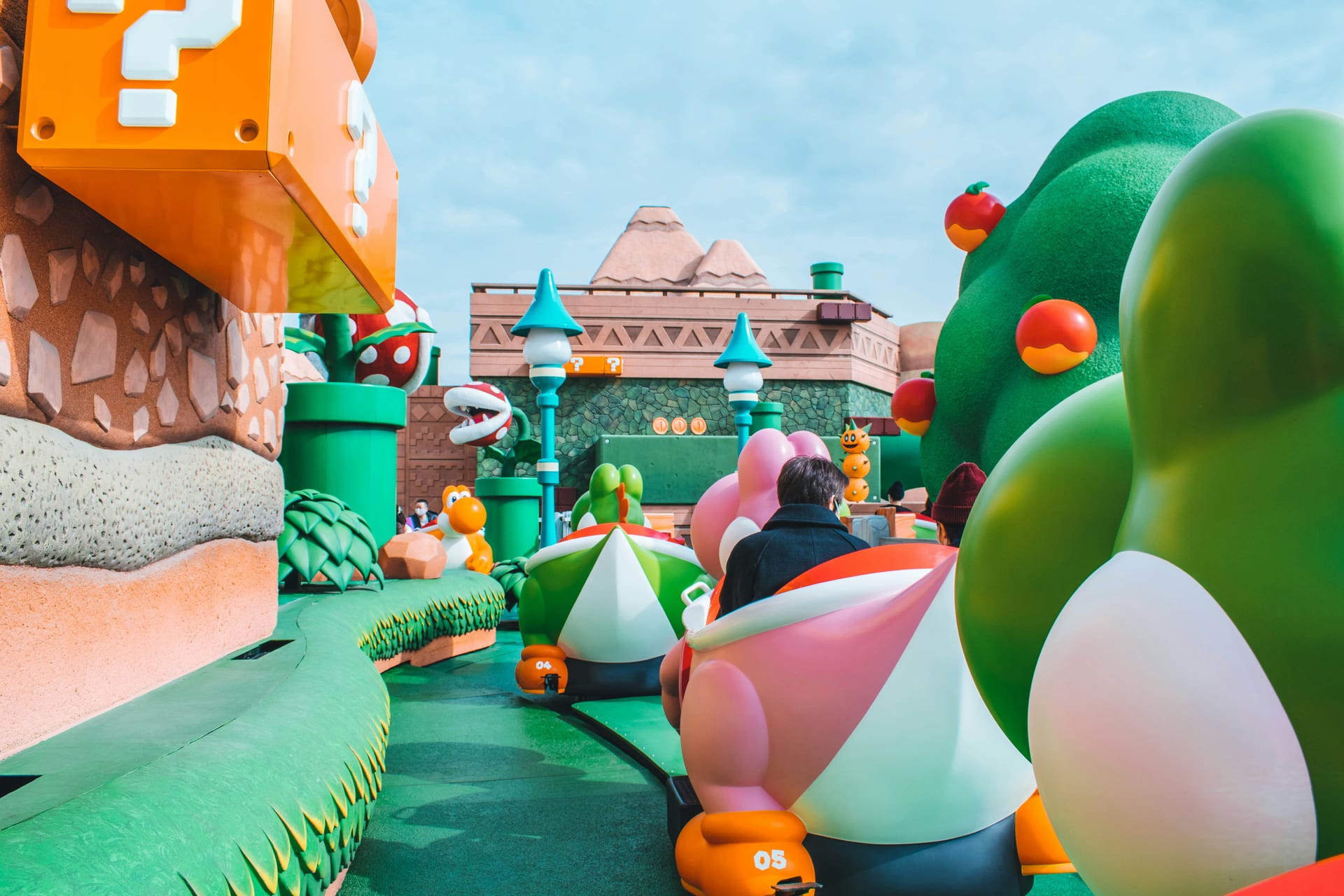 Universal Studios Japan themed streets and park entrance with crowds of visitors, Osaka